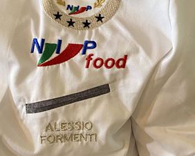 Camice professionale Alessio Formenti con logo Nip Food e titolo Master Chef